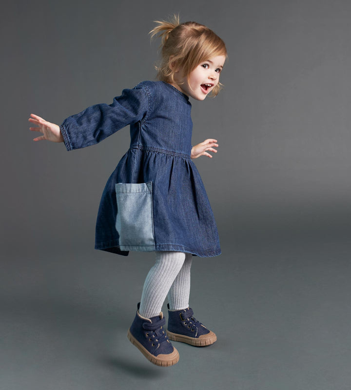 Betsy (age 2) jumping in our KIDLY Label Denim Pocket Dress